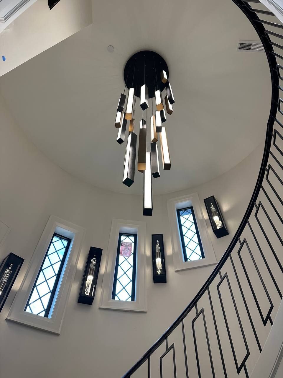 Chandelier wired over a curved stairwell in a Clark County WA home
